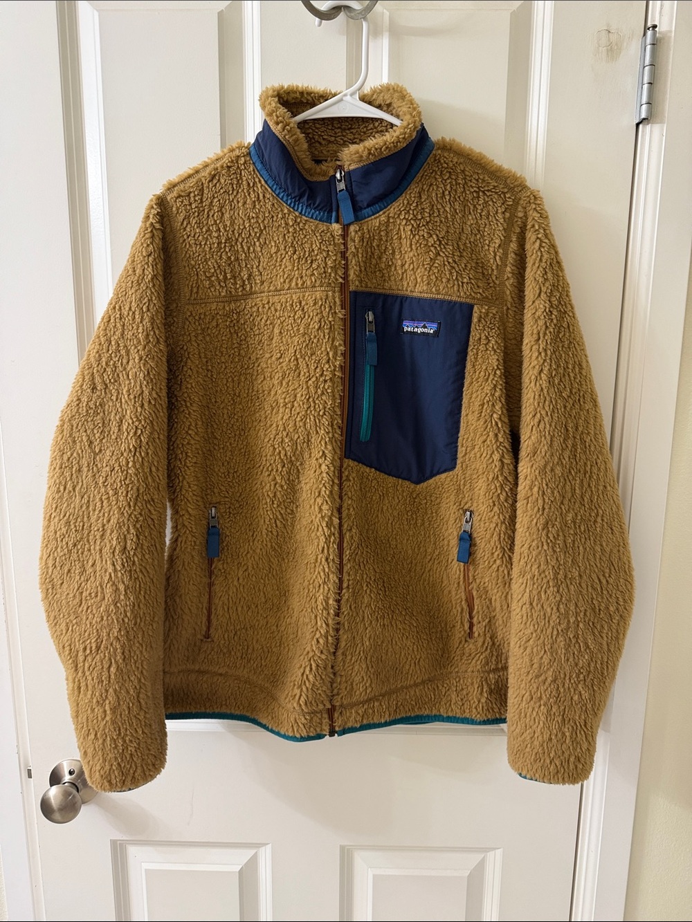 Patagonia Tan Sherpa Jacket with Navy Chest Pocket and Teal Zippers